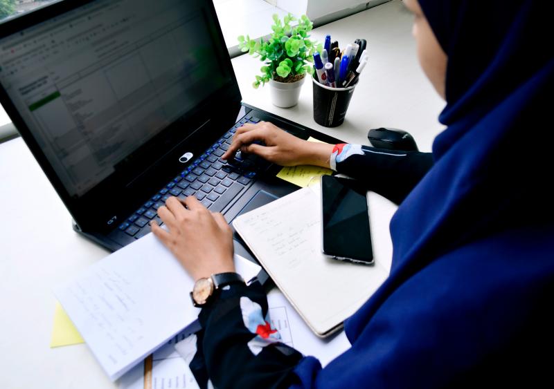 Woman working at laptop