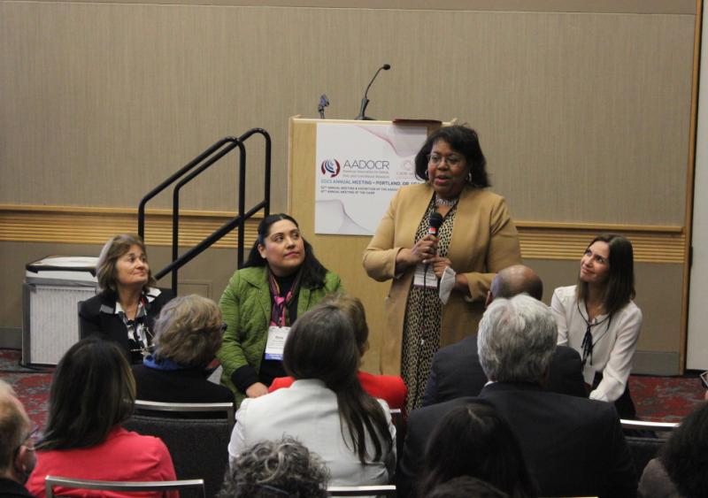 women sitting AA meeting collaboration